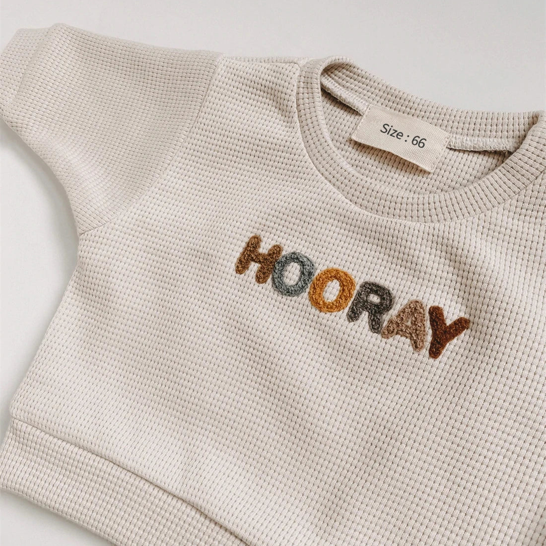 Front view of the baby clothing set